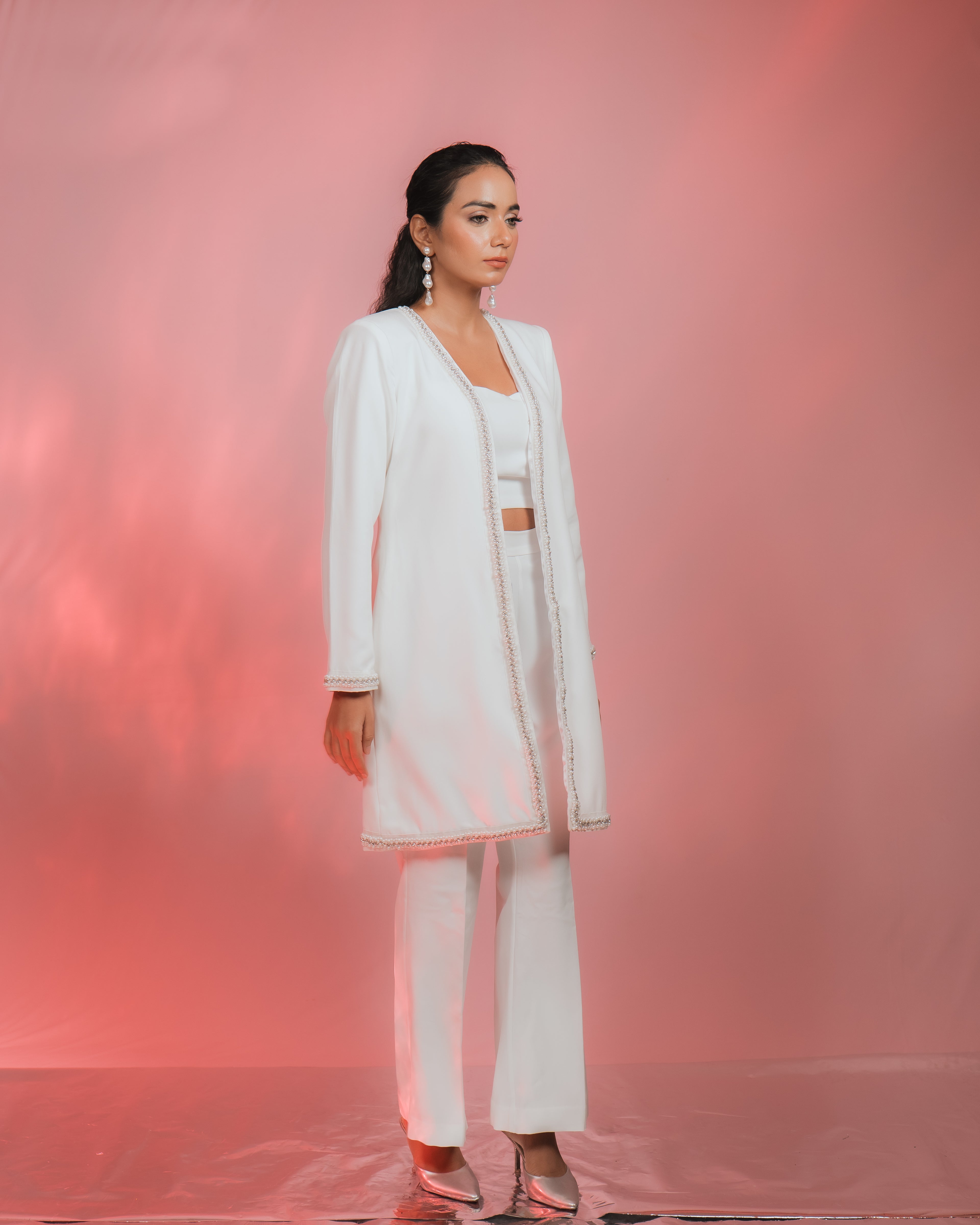 NUA RHINESTONES & PERAL EMBELLISHED JACKET worn by a model against a pink background.